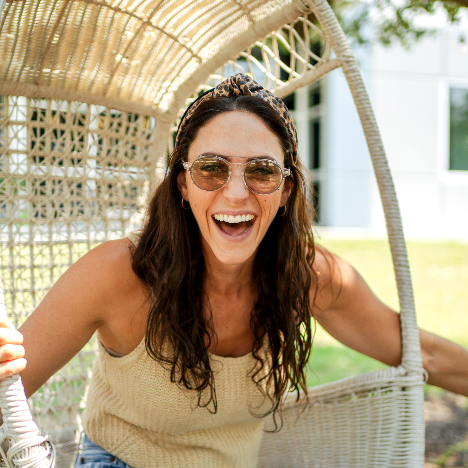 Happy woman wearing Axon optics with avulux migraine lenses