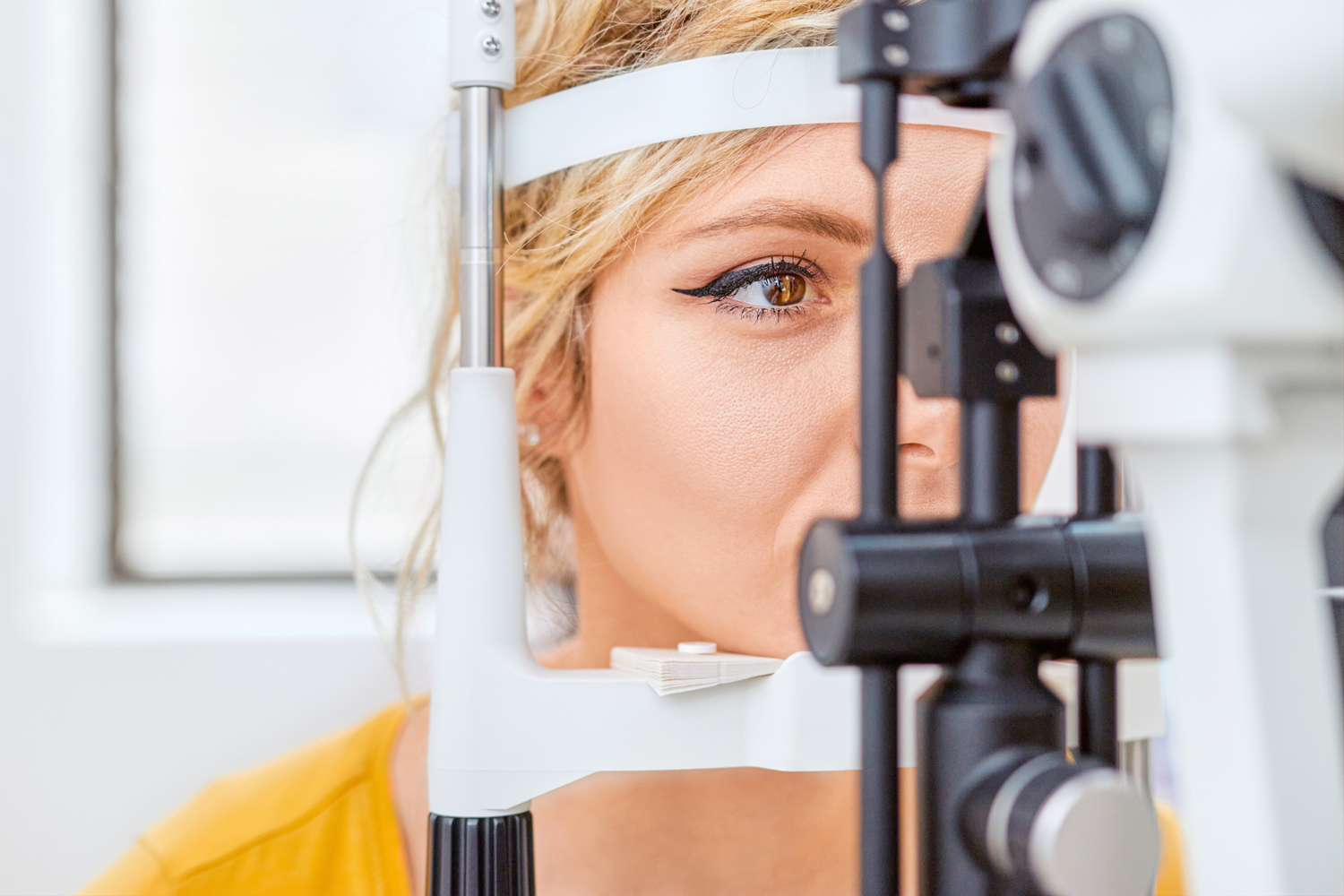 woman getting optometric eye exam