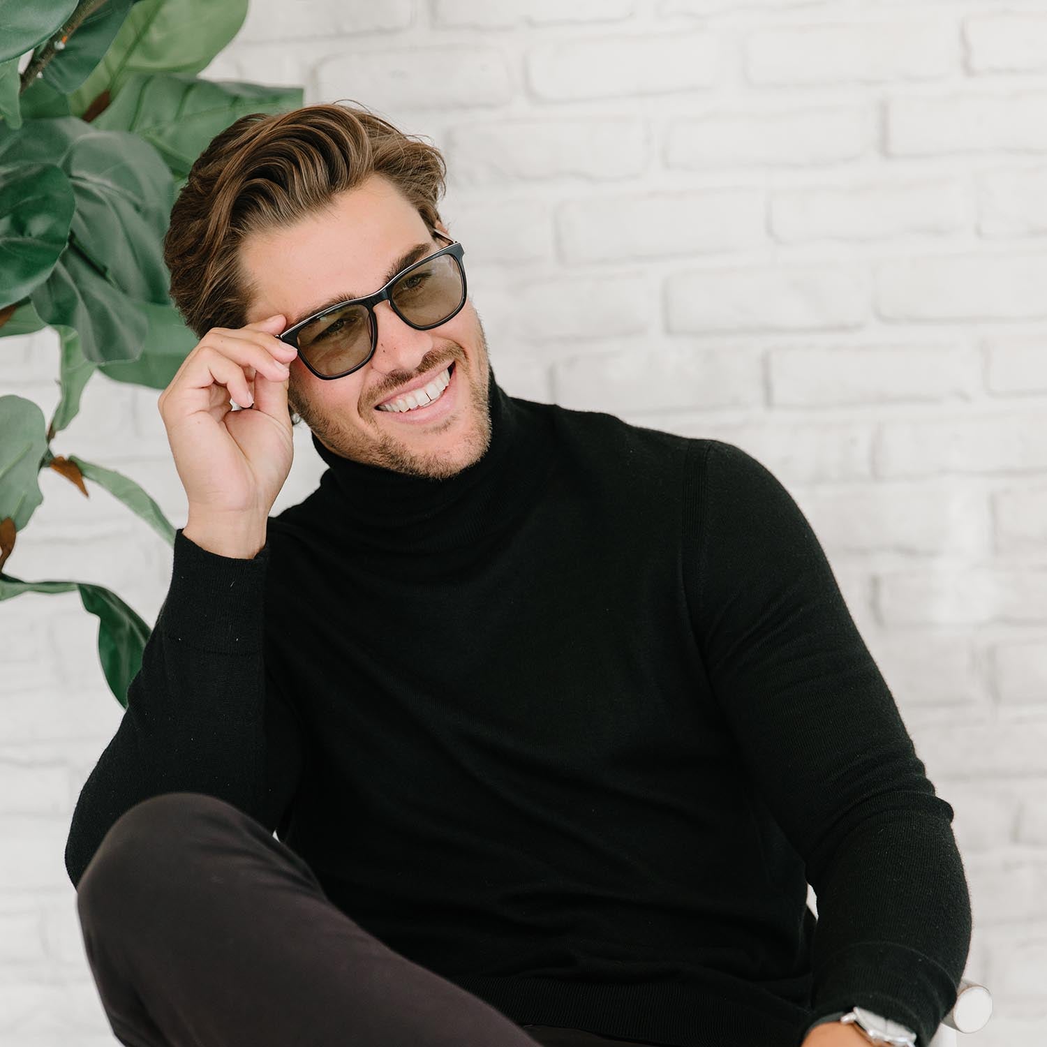 man wearing axon optics powerwed by avulux lenses indoors