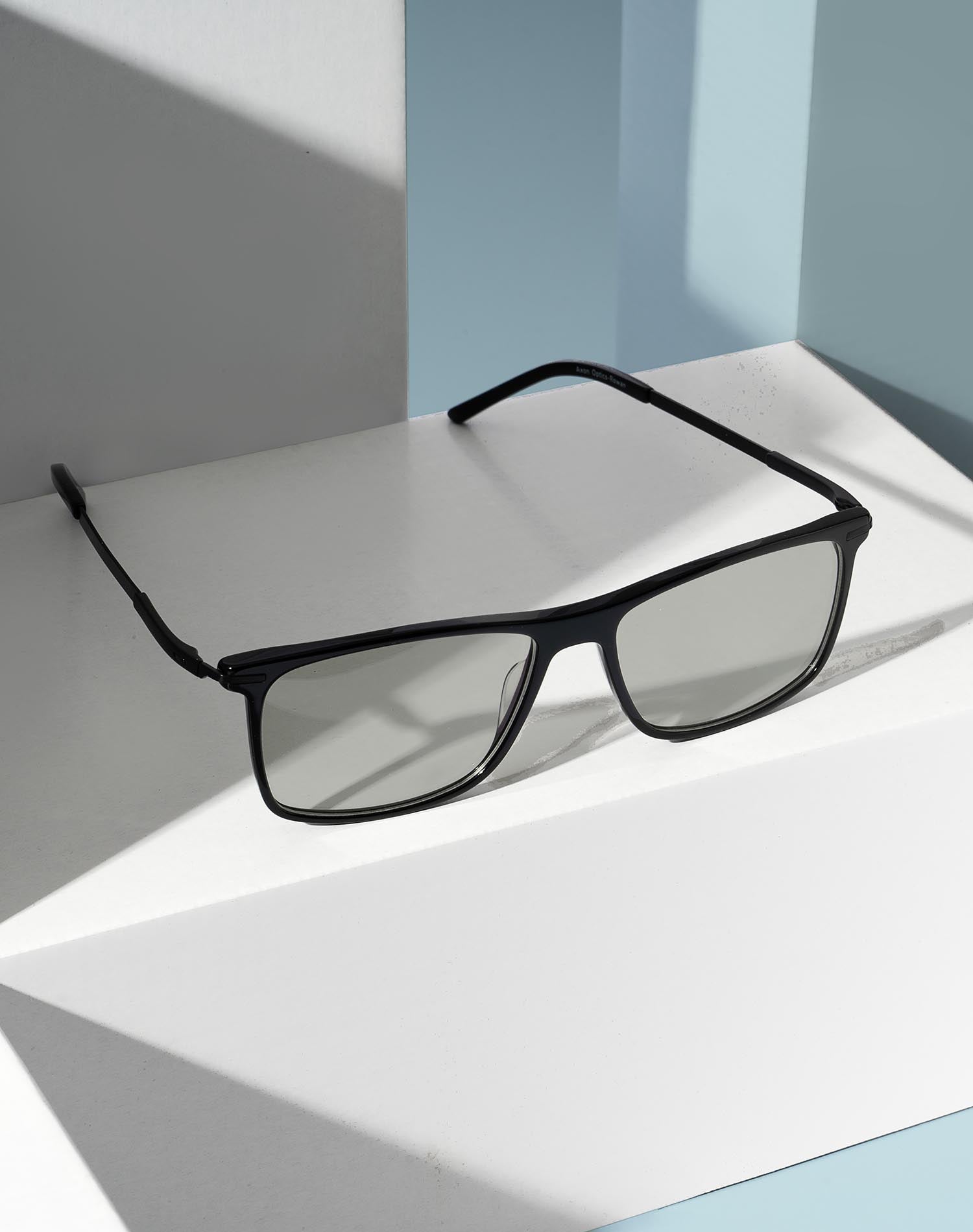 rowan migraine glasses placed on white block